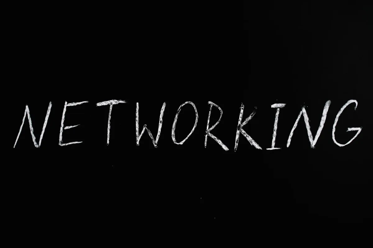 Handwritten 'Networking' text on a chalkboard styled black background, symbolizing communication.